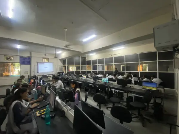Students coding at a college lab session