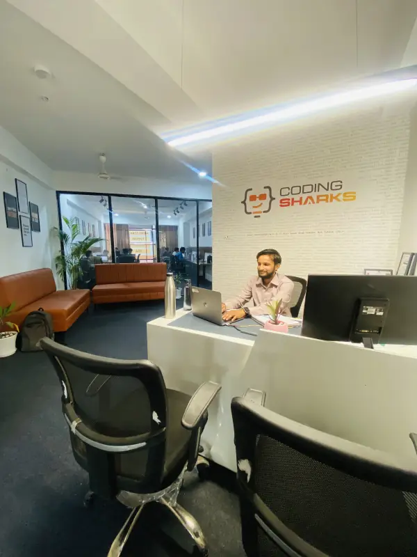 Coding Sharks reception and logo wall in Bhawarkua