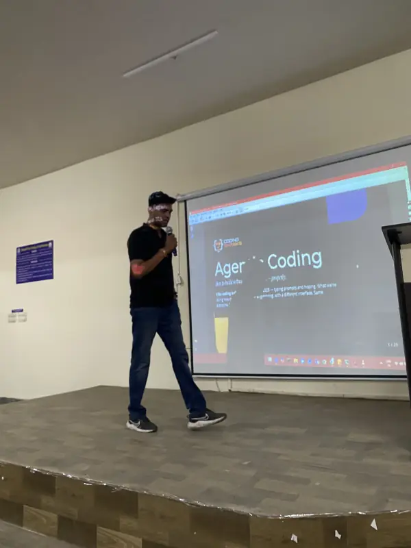 Coding Sharks mentor presenting Agentic Coding on stage